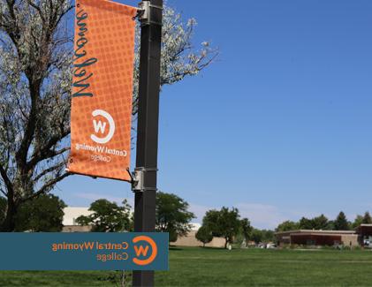 CWC Riverton Campus lightpole with orange welcome banner attached